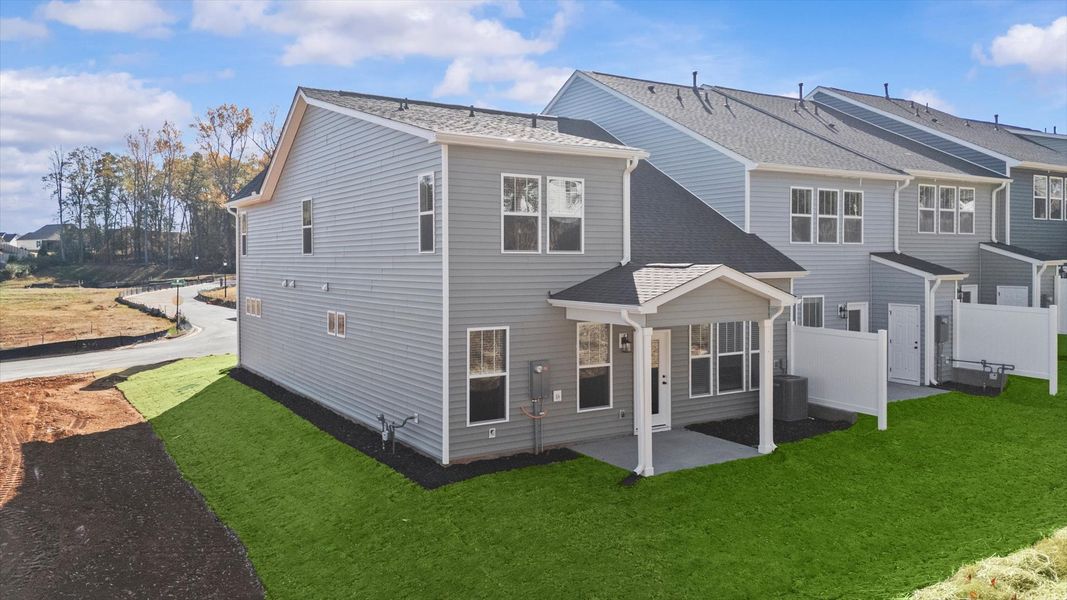 Warm and inviting outdoor living space with a covered rear porch and tasteful finishes
