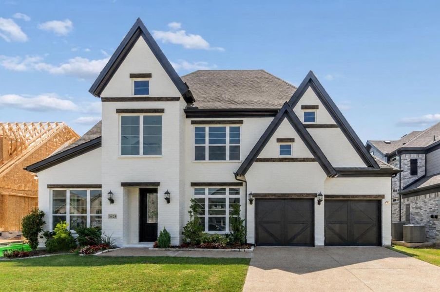 Front exterior of a new home in Monterra, Rockwall, TX, highlighting curb appeal (Image 1). Front exterior of a new home in Monterra, Rockwall, TX, highlighting curb appeal (Image 1).