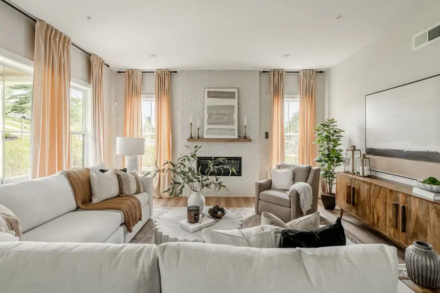 Representative furnished interior of a home built from the Covington by Keystone Custom Homes in McLean South Shore, Belmont (Image 8).