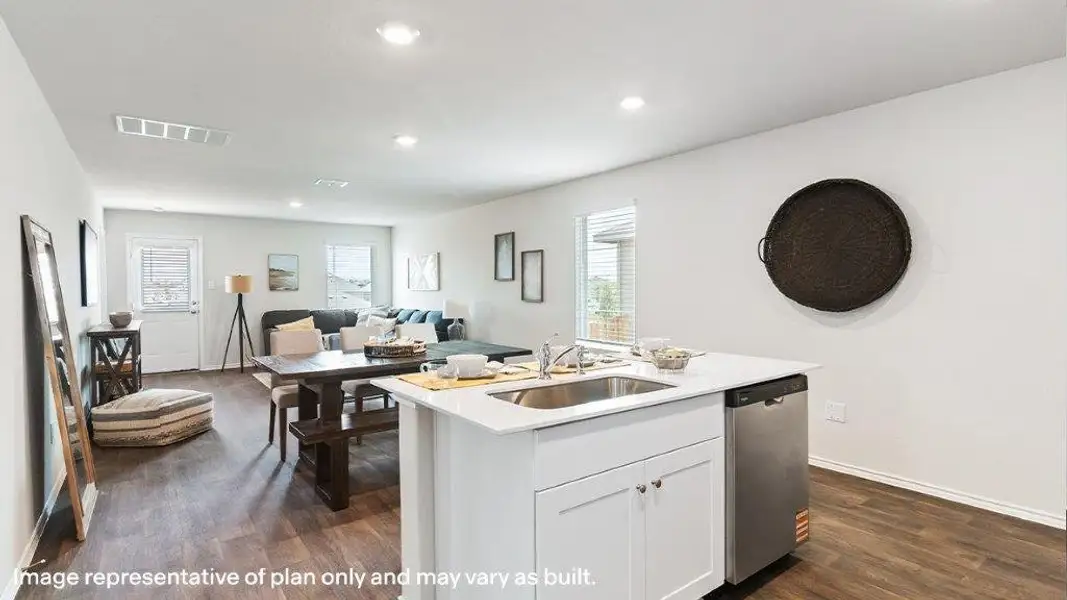An open concept design seamlessly connects the kitchen to the living and dining areas, fostering a welcoming atmosphere. An open concept design seamlessly connects the kitchen to the living and dining areas, fostering a welcoming atmosphere.