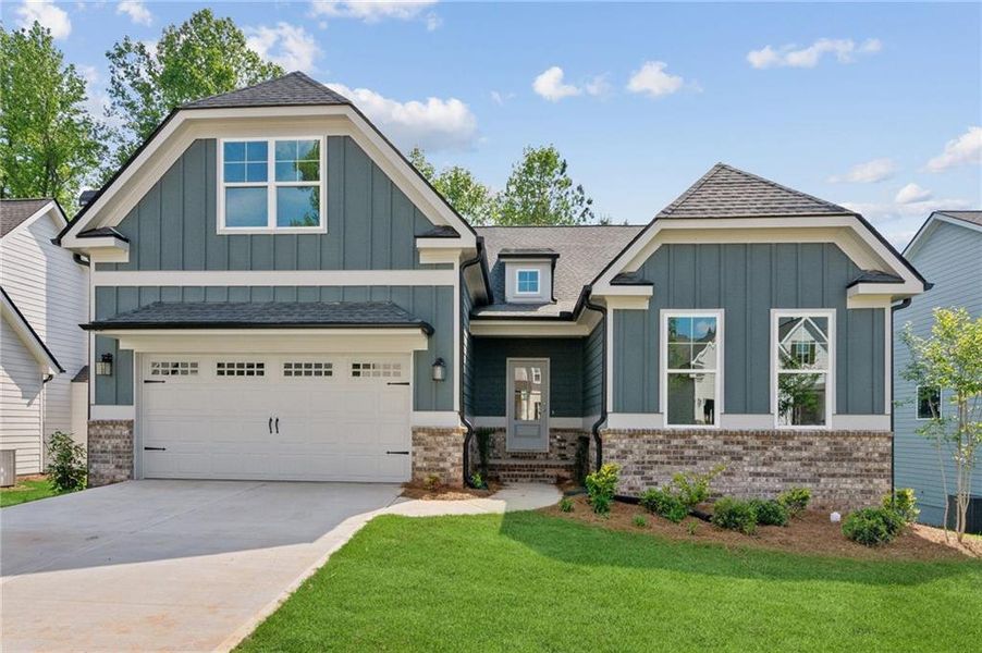 Front exterior of a new home in Traditions of Braselton, Jefferson, GA, highlighting curb appeal (Image 1).