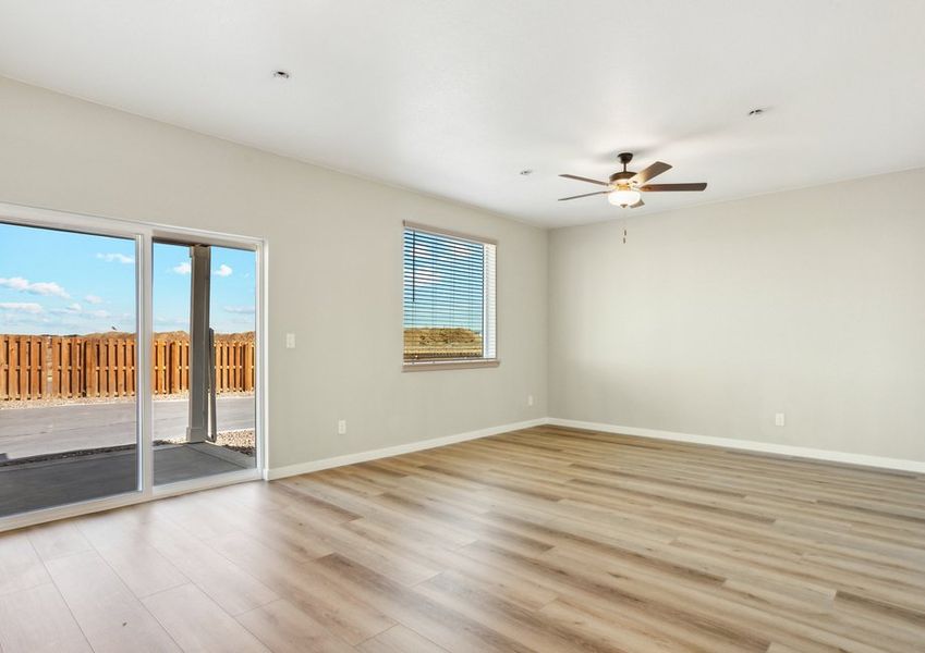 The family room is spacious with a ceiling fan.