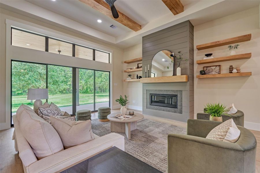 Exposed beam ceilings, a striking shiplap fireplace, and rich engineered white oak hardwood floors set the tone for refined living. Walls of glass dissolve the line between indoors and out — an effortless space for quiet evenings in or elegant gatherings that flow seamlessly to the porch beyond. Exposed beam ceilings, a striking shiplap fireplace, and rich engineered white oak hardwood floors set the tone for refined living. Walls of glass dissolve the line between indoors and out — an effortless space for quiet evenings in or elegant gatherings that flow seamlessly to the porch beyond.