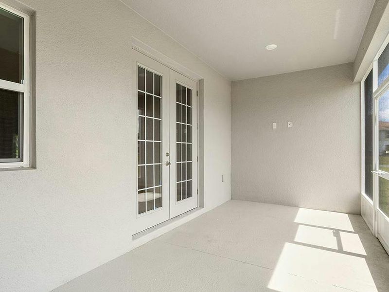 Your interior opens to outdoor living space on a large covered lanai - Willow II with Loft by Highland Homes