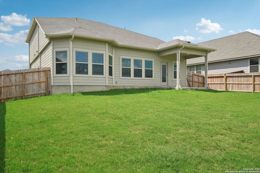 Front exterior of a new home in Legendary Trails - Classic Series, Cibolo, TX, highlighting curb appeal (Image 30). Front exterior of a new home in Legendary Trails - Classic Series, Cibolo, TX, highlighting curb appeal (Image 30).