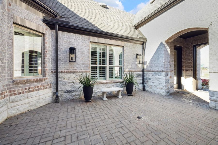 Front exterior of a new home in Elyson, Katy, TX, highlighting curb appeal (Image 19).