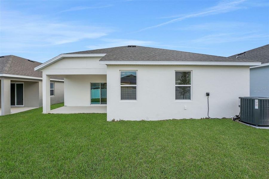 Exterior details and patio area of a home in Cypress Park Estates, Haines City (Image 22).