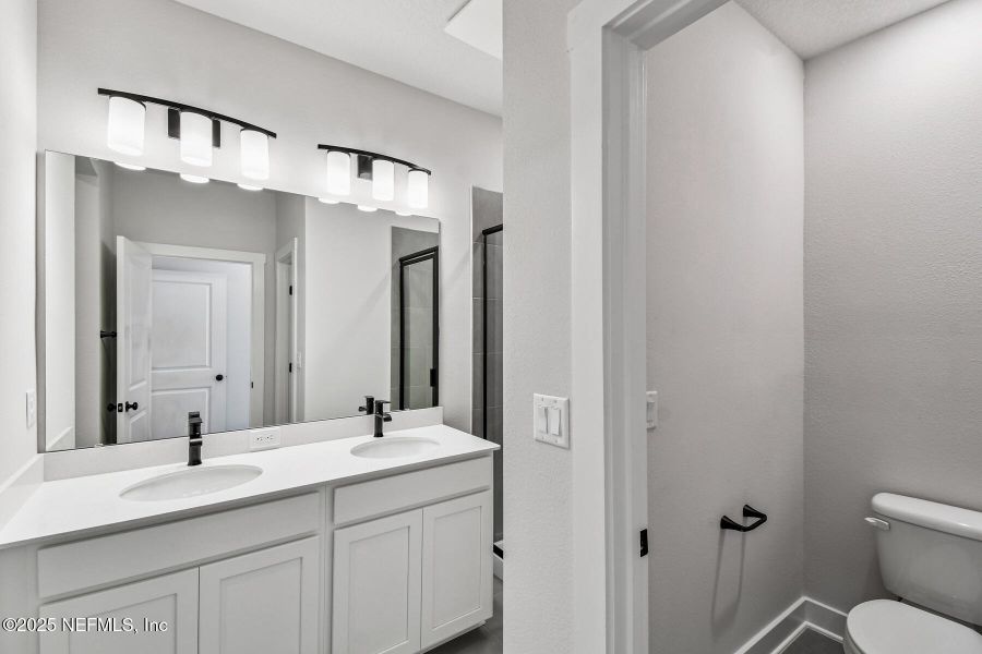 Furnished interior view inside a new home in Kettering at eTown - Garden Collection, Jacksonville (Image 9). Furnished interior view inside a new home in Kettering at eTown - Garden Collection, Jacksonville (Image 9).