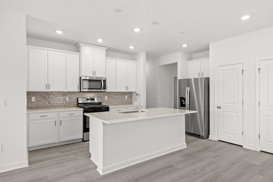 Furnished interior view inside a new home in Waterside - Boardwalk Series, Longs (Image 5).