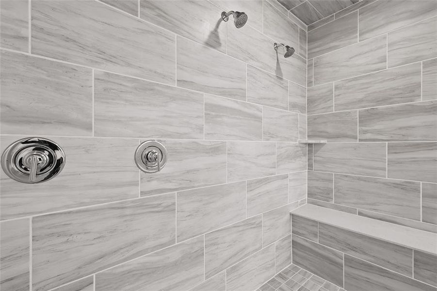 Bathroom featuring a tile shower