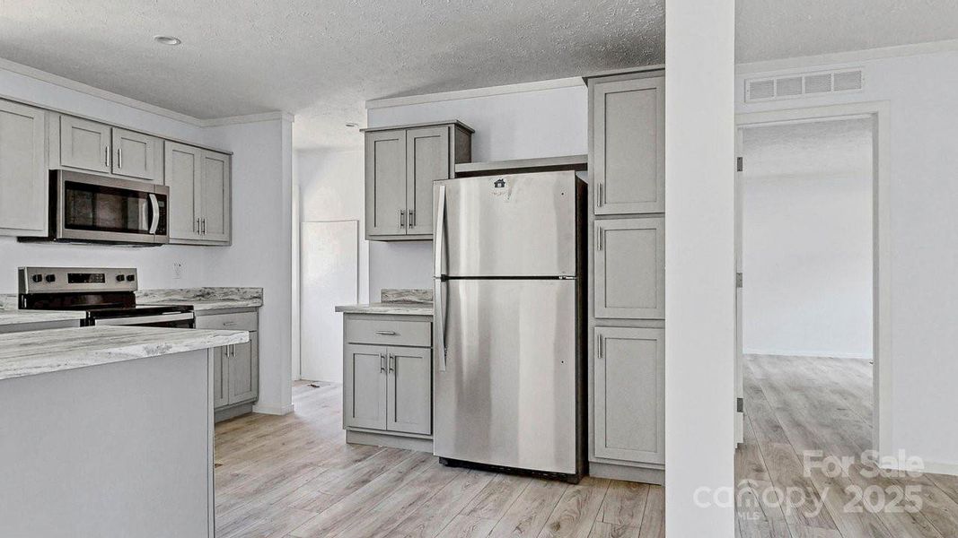 Furnished interior view inside a new home in , Statesville (Image 3).