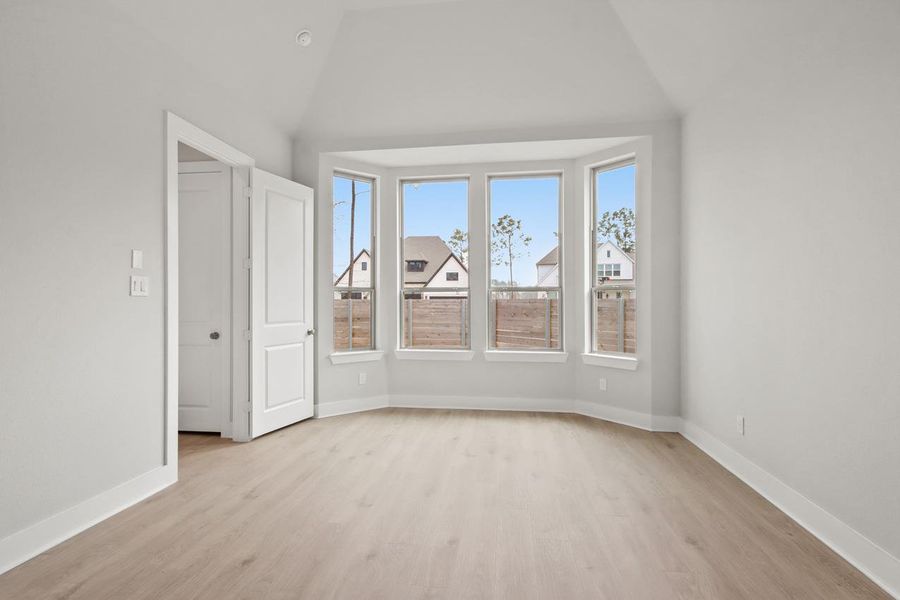 Unfurnished room with baseboards and light wood-style flooring Unfurnished room with baseboards and light wood-style flooring