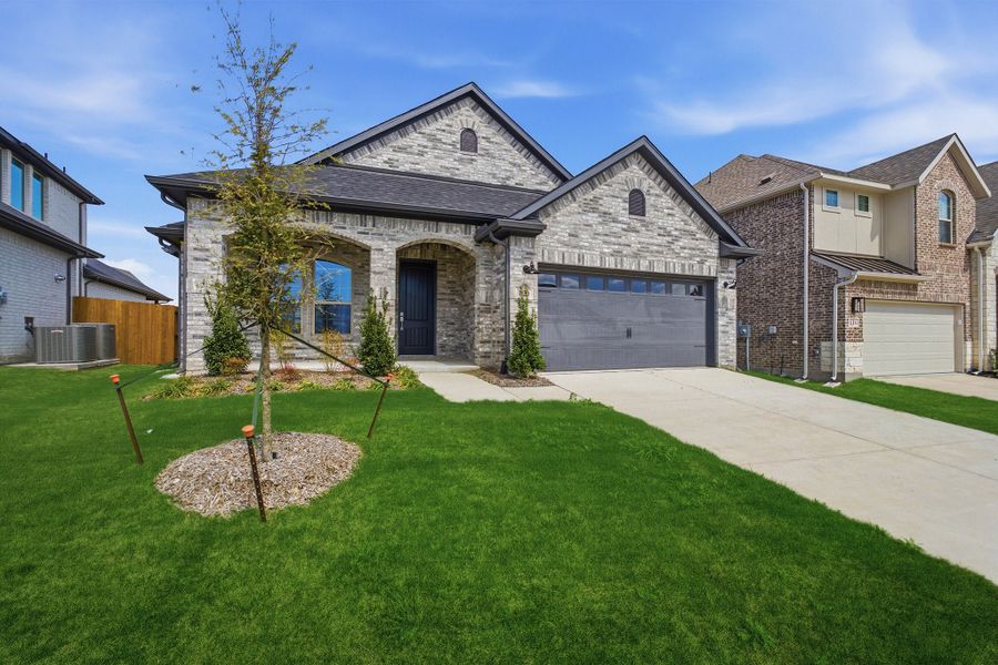 Front exterior of a new home in Westridge, McKinney, TX, highlighting curb appeal (Image 18). Front exterior of a new home in Westridge, McKinney, TX, highlighting curb appeal (Image 18).