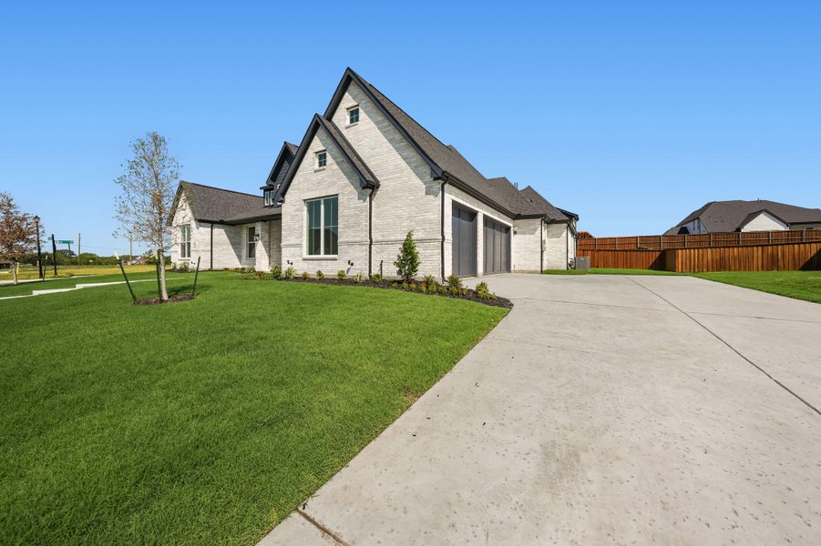 Front exterior of a new home in Winding Creek, Rockwall, TX, highlighting curb appeal (Image 26).