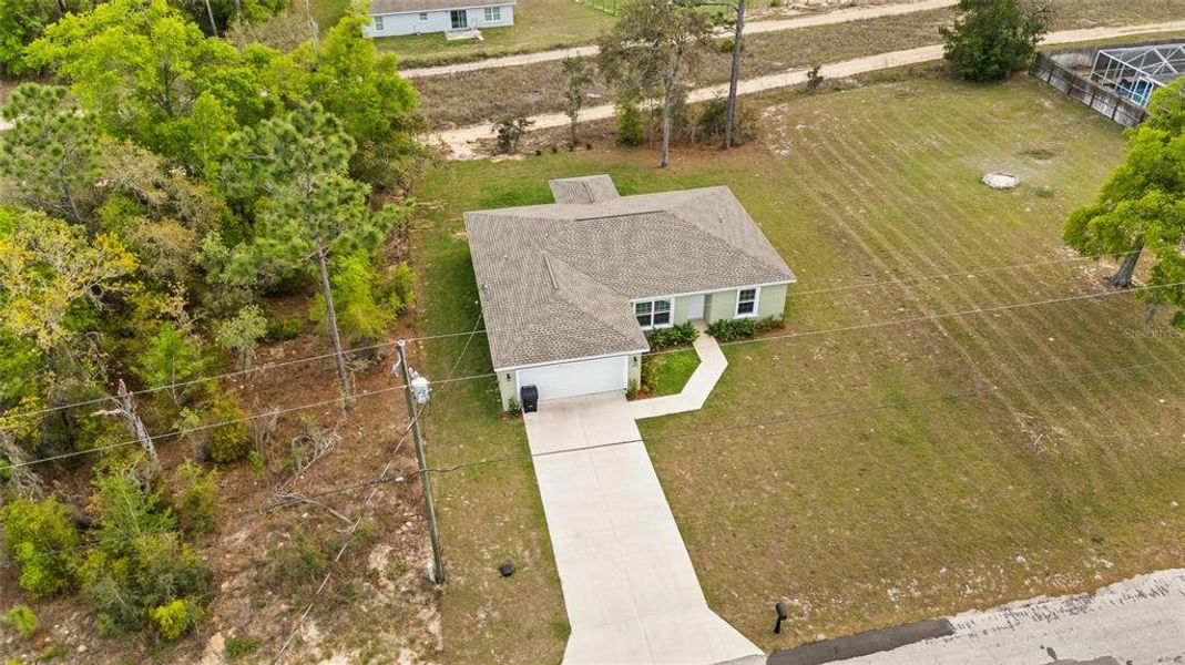 Front exterior of a new home in , Dunnellon, FL, highlighting curb appeal (Image 23).