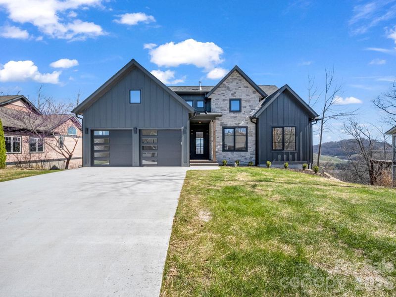 Front exterior of a new home in , Hendersonville, NC, highlighting curb appeal (Image 1). Front exterior of a new home in , Hendersonville, NC, highlighting curb appeal (Image 1).