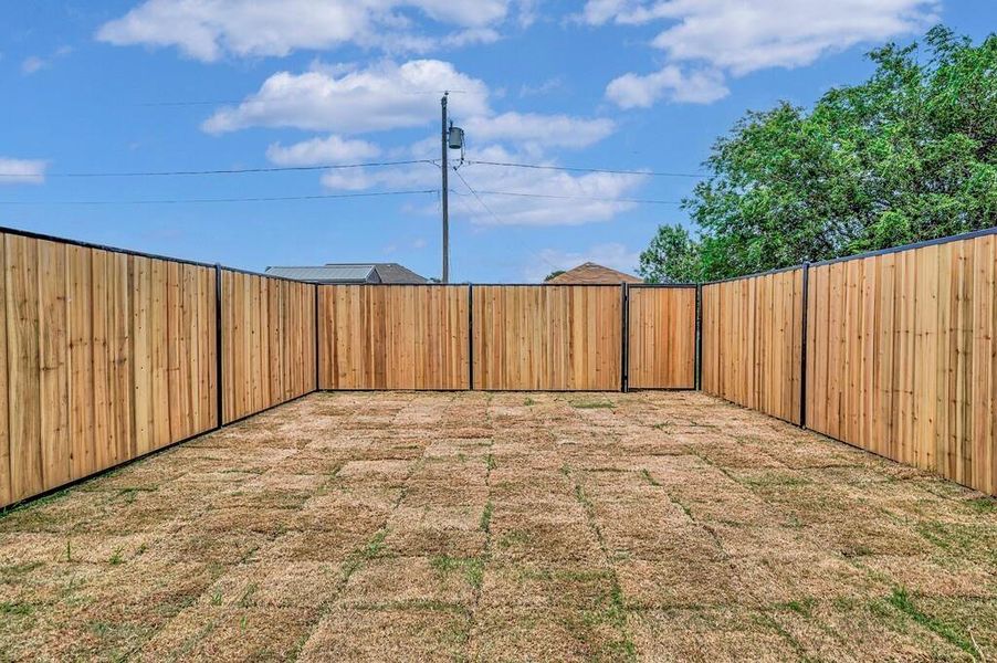 View of fenced backyard