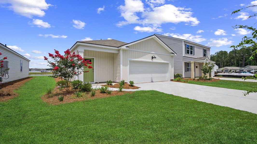 Front exterior of a new home in The Retreat at East Argent, Ridgeland, SC, highlighting curb appeal (Image 20). Front exterior of a new home in The Retreat at East Argent, Ridgeland, SC, highlighting curb appeal (Image 20).