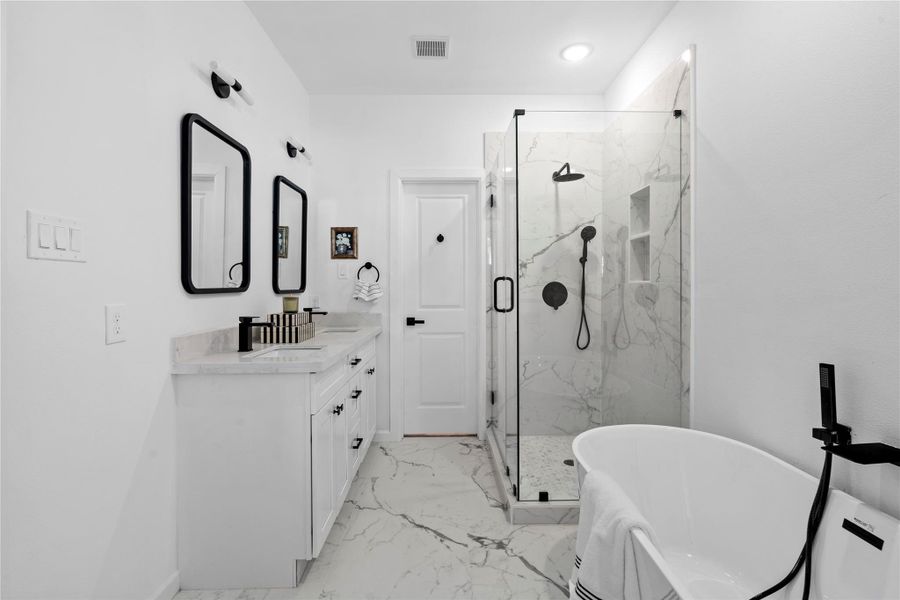 Bright, practical layout—double vanity, generous storage, and clean lines that look custom without the custom price. Bright, practical layout—double vanity, generous storage, and clean lines that look custom without the custom price.