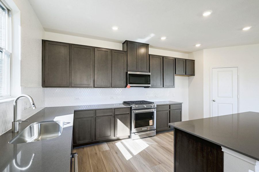 Furnished interior view inside a new home in Salerno - Classic Collection, Round Rock (Image 13). Furnished interior view inside a new home in Salerno - Classic Collection, Round Rock (Image 13).