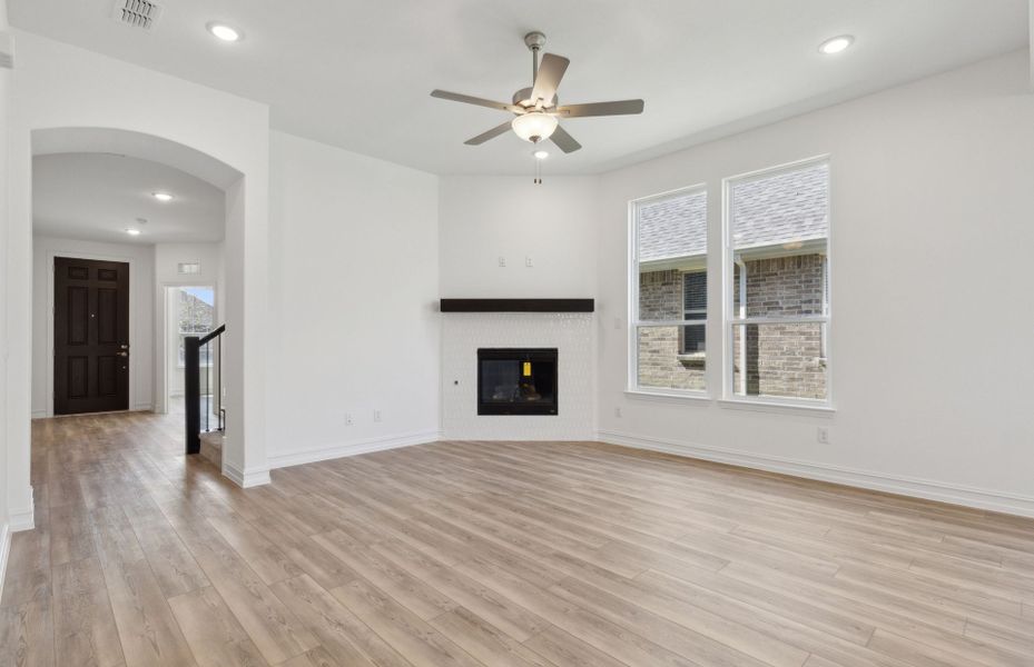 Expansive gathering room with charming fireplace *real home pictured