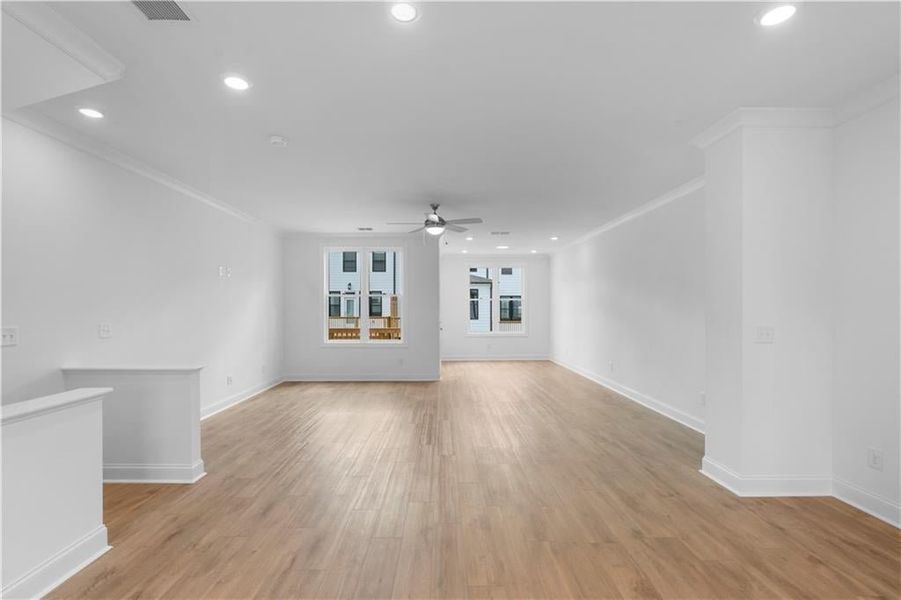 All open living with the sunroom, dining, family room and kitchen. *Pictures represent a previously built home, not the actual home, home is under construction*