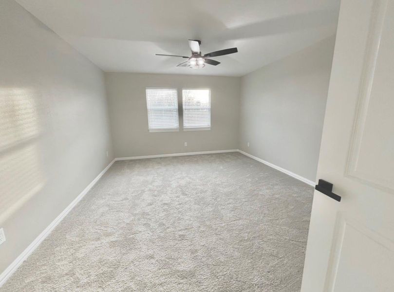 Spacious 14x15 secondary bedroom with ample natural light.