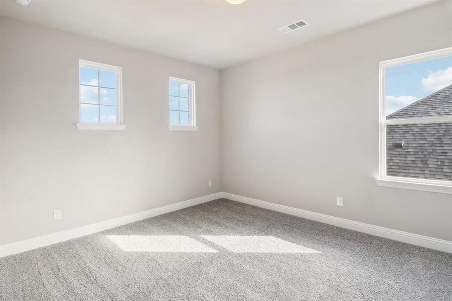 View of carpeted spare room