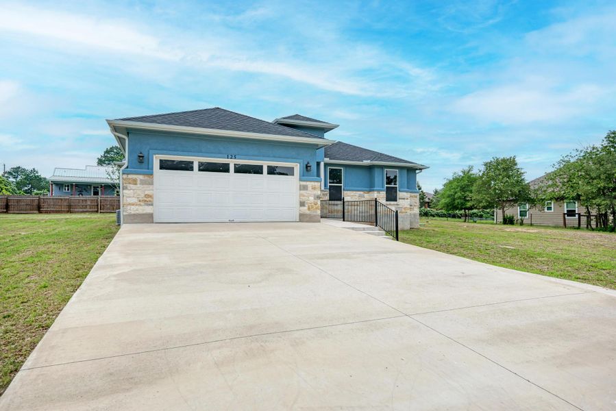 Front exterior of a new home in , Paige, TX, highlighting curb appeal (Image 22).
