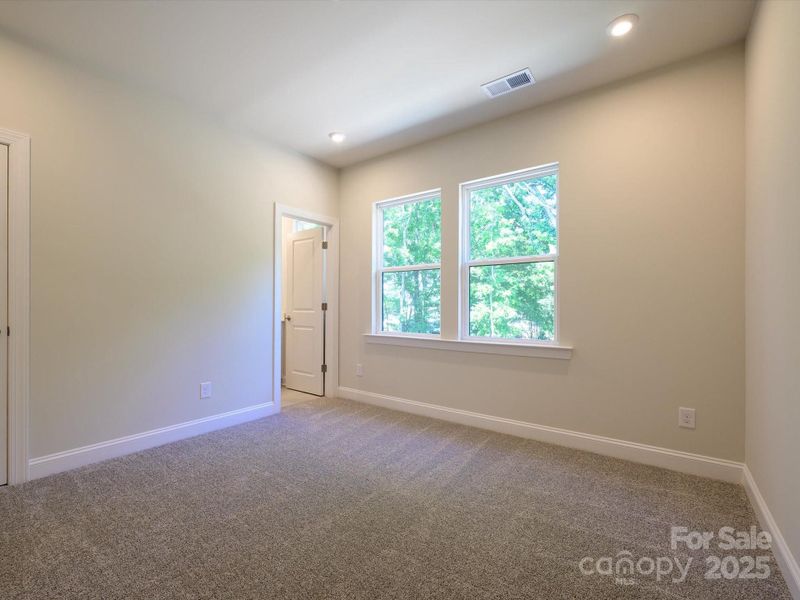 Secondary Bedroom with En Suite Bath and Bright Windows