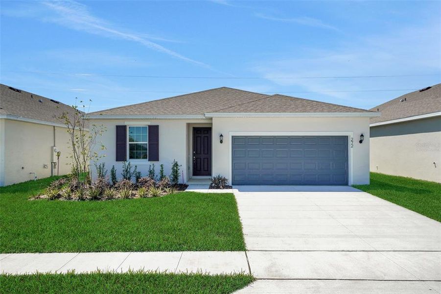 Front exterior of a new home in Willowbrook North, Winter Haven, FL, highlighting curb appeal (Image 1). Front exterior of a new home in Willowbrook North, Winter Haven, FL, highlighting curb appeal (Image 1).