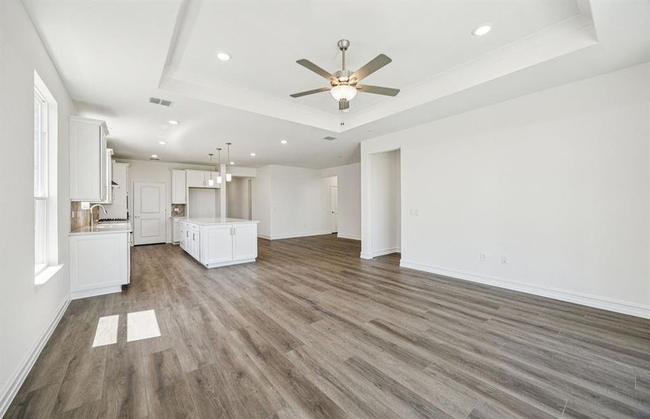 Open concept gathering room creating a spacious and inviting atmosphere *Real home pictured Open concept gathering room creating a spacious and inviting atmosphere *Real home pictured