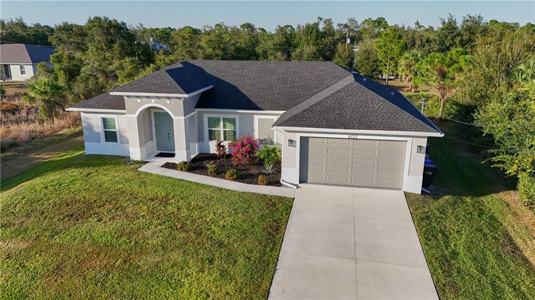 Front exterior of a new home in , North Port, FL, highlighting curb appeal (Image 1).