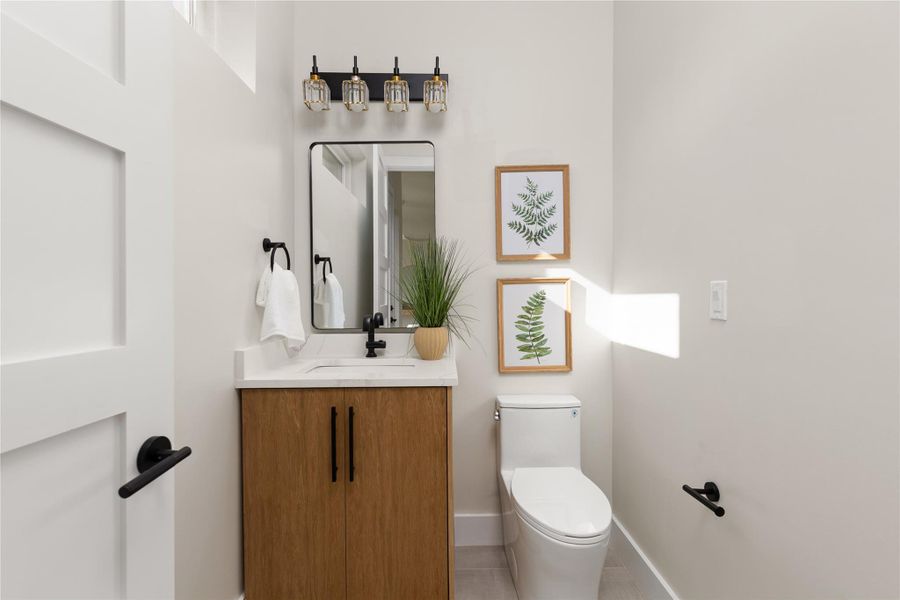 Clean lines and a modern vanity define this stylish powder room.