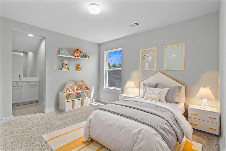 Secondary bedroom features plush carpet, custom paint, high ceilings, and a large window with privacy blinds. This bedroom has its own private vanity and shares a jack and jill bathroom with another secondary bedroom.