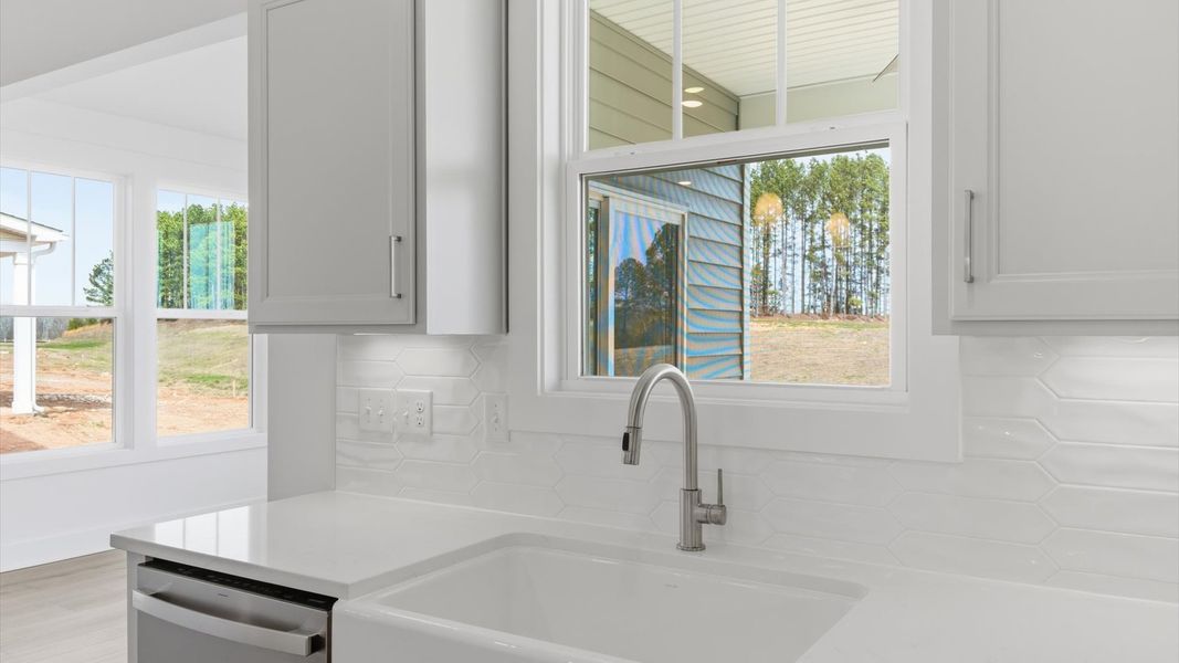 Elegant kitchen with modern finishes in this first-class home at Foxbank in Gray Court, SC