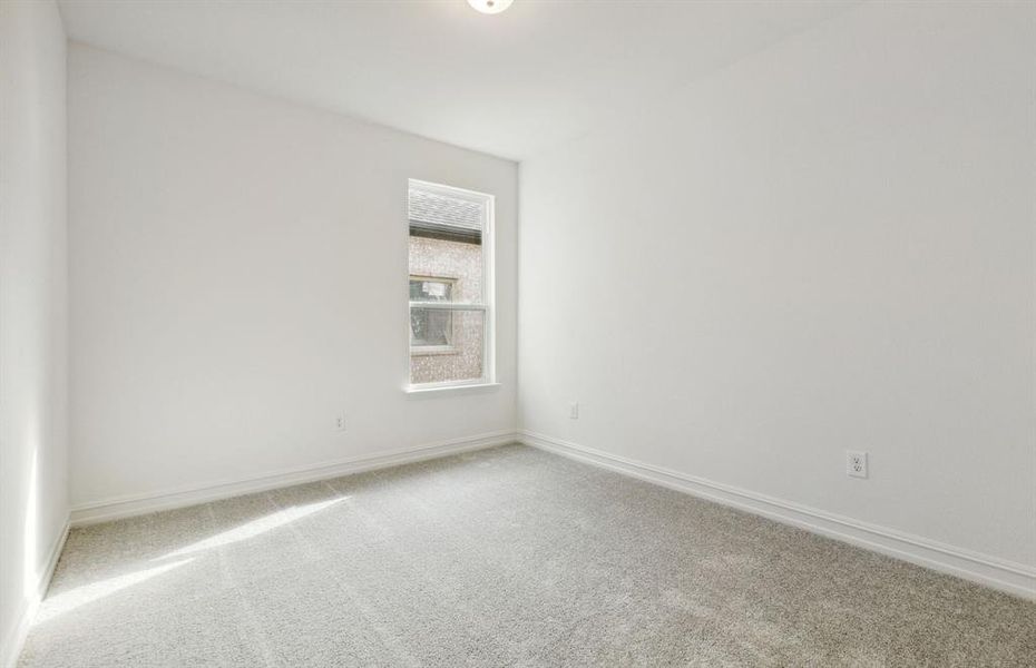 Spacious secondary bedroom with ample closet space *real home pictured