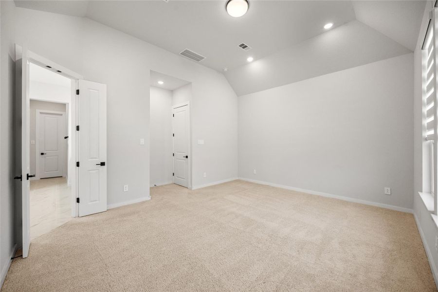another view of primary bedroom