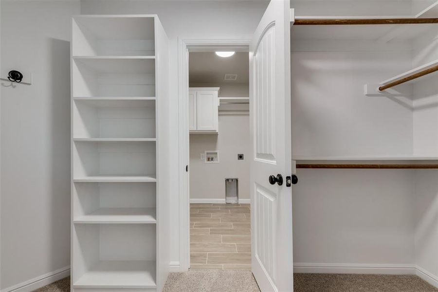 Walk in closet connecting to laundry room!