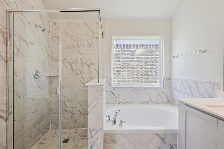 Bathroom with vanity and independent shower and bath