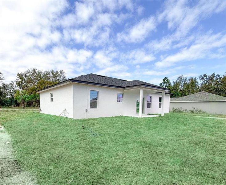 Front exterior of a new home in , Ocklawaha, FL, highlighting curb appeal (Image 17).