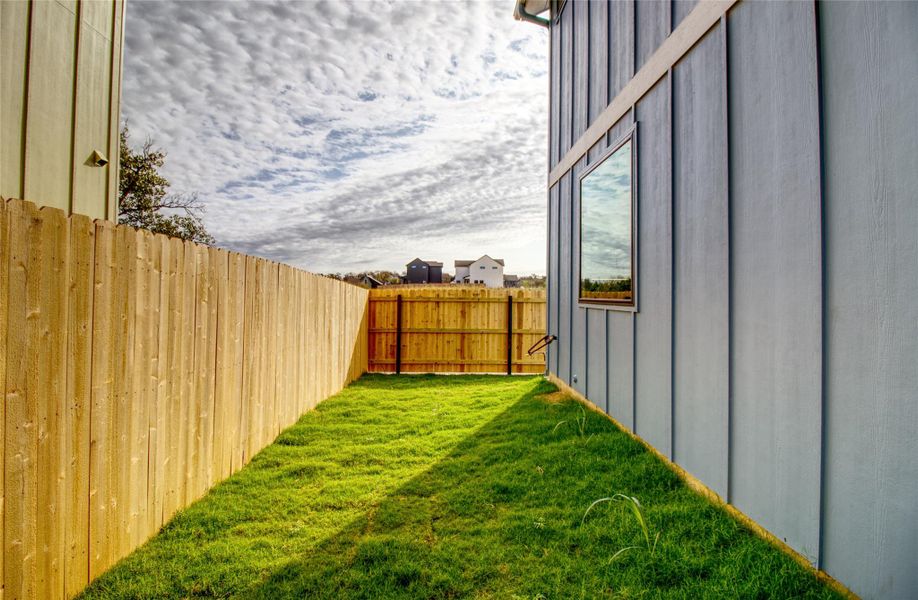 View of fenced backyard