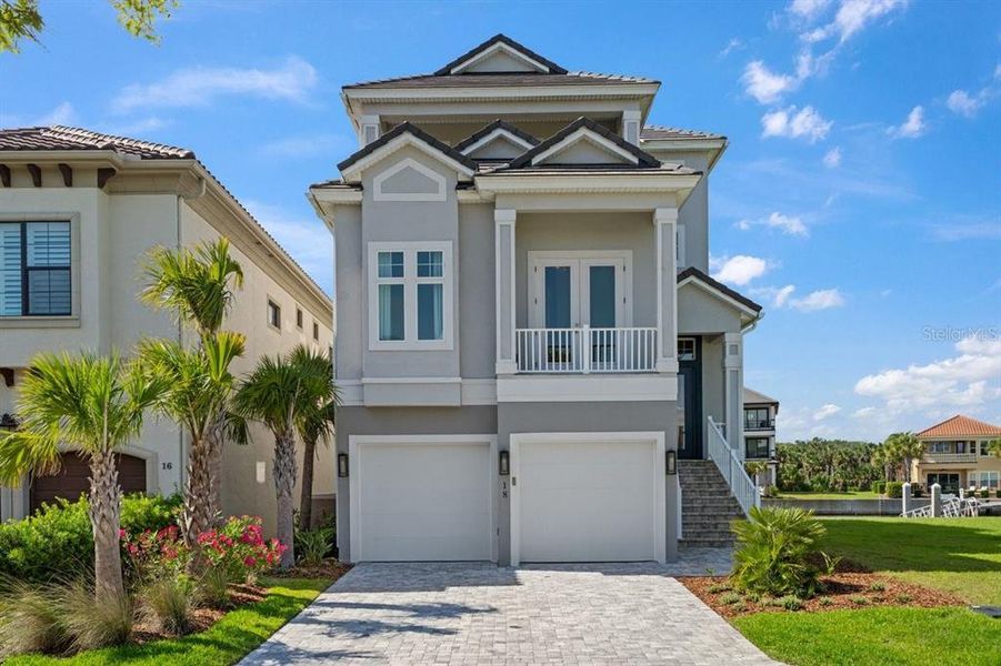 Front exterior of a new home in , Palm Coast, FL, highlighting curb appeal (Image 1). Front exterior of a new home in , Palm Coast, FL, highlighting curb appeal (Image 1).