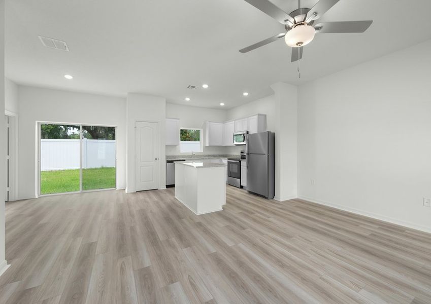 The kitchen island overlooks the dining room