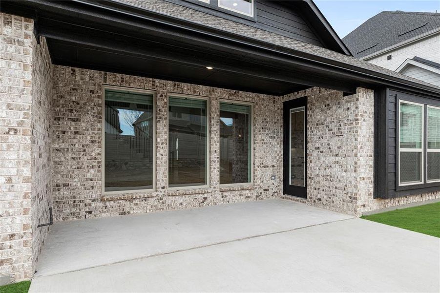 Exterior details and patio area of a home in Painted Tree, McKinney (Image 28).