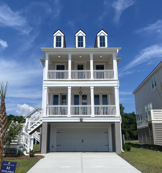 Front exterior of a new home in Miller's Crossing, Johns Island, SC, highlighting curb appeal (Image 1). Front exterior of a new home in Miller's Crossing, Johns Island, SC, highlighting curb appeal (Image 1).