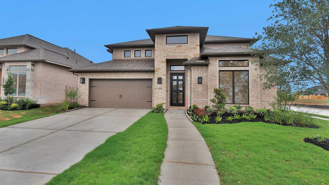 Front exterior of a new home in Midline, Houston, TX, highlighting curb appeal (Image 1). Front exterior of a new home in Midline, Houston, TX, highlighting curb appeal (Image 1).