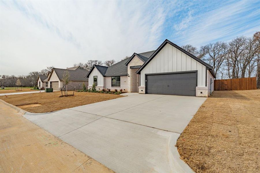 Front exterior of a new home in , Tolar, TX, highlighting curb appeal (Image 22).