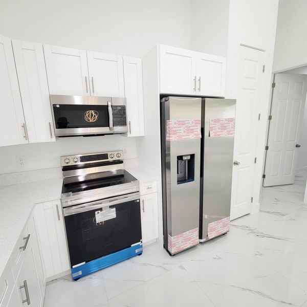Furnished interior view inside a new home in , Okeechobee (Image 8).