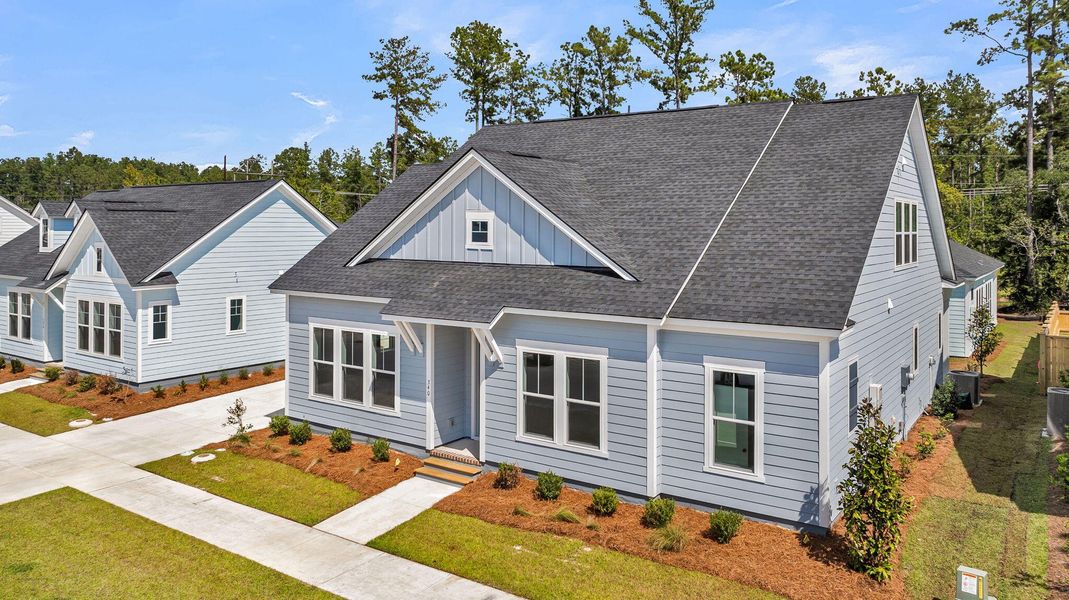 Front exterior of a new home in Nexton – Midtown – The Garden Collection, Summerville, SC, highlighting curb appeal (Image 23).